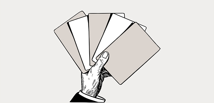 illustration av hand som håller i kort. 